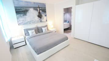 2 habitaciones, tabla de planchar con plancha, cuna de viaje y wifi