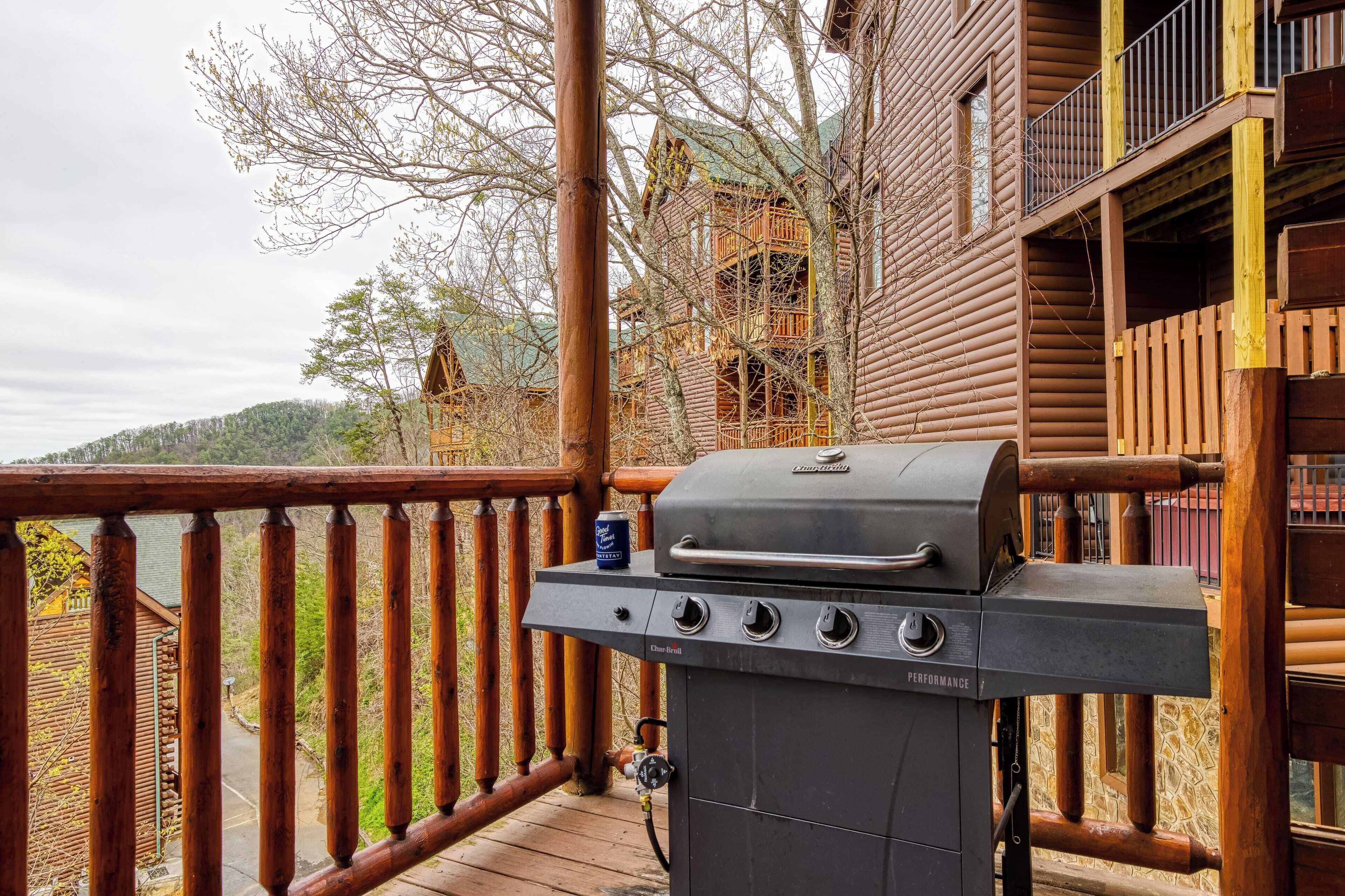 A wooden deck with a barbecue grill and a can of beer.