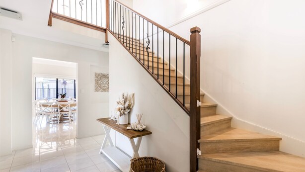 A staircase with wooden steps and a metal railing, leading to an upper floor. - Water Lane - Swimming Pool - 4 Mins Walk to Bay (Callala Bay)