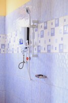 Basic Single Room, Private Bathroom, Garden View | Bathroom | Shower, towels, soap, toilet paper