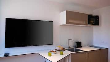 Microwave, stovetop, coffee/tea maker, cookware/dishes/utensils