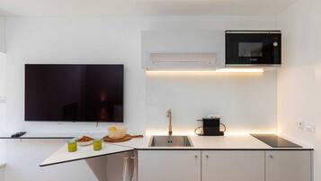 Microwave, stovetop, coffee/tea maker, cookware/dishes/utensils