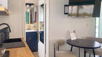 Standard Suite, Multiple Beds, Kitchen, Pool View | Bathroom | Hair dryer, towels, toilet paper
