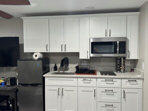 Fridge, microwave, stovetop, coffee/tea maker