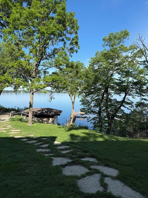 A lakeside property with a gazebo, stone pathway, and a view of the water. - Haywards Bay Estate and Guest House on West Lake (Okoboji)