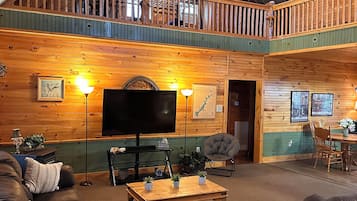 Smart TV, fireplace, books, computer monitors