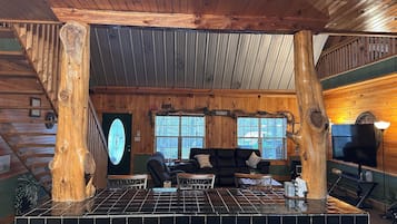 Smart TV, fireplace, books, computer monitors