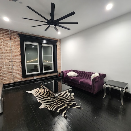 Living area. Charming and unique upscale 1-bedroom apartment in downtown Okmulgee