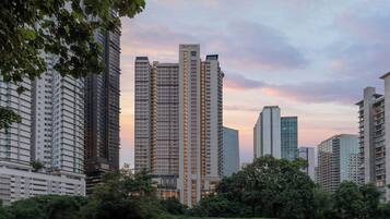 A high-rise building with a Marriott sign, surrounded by other tall buildings and greenery.