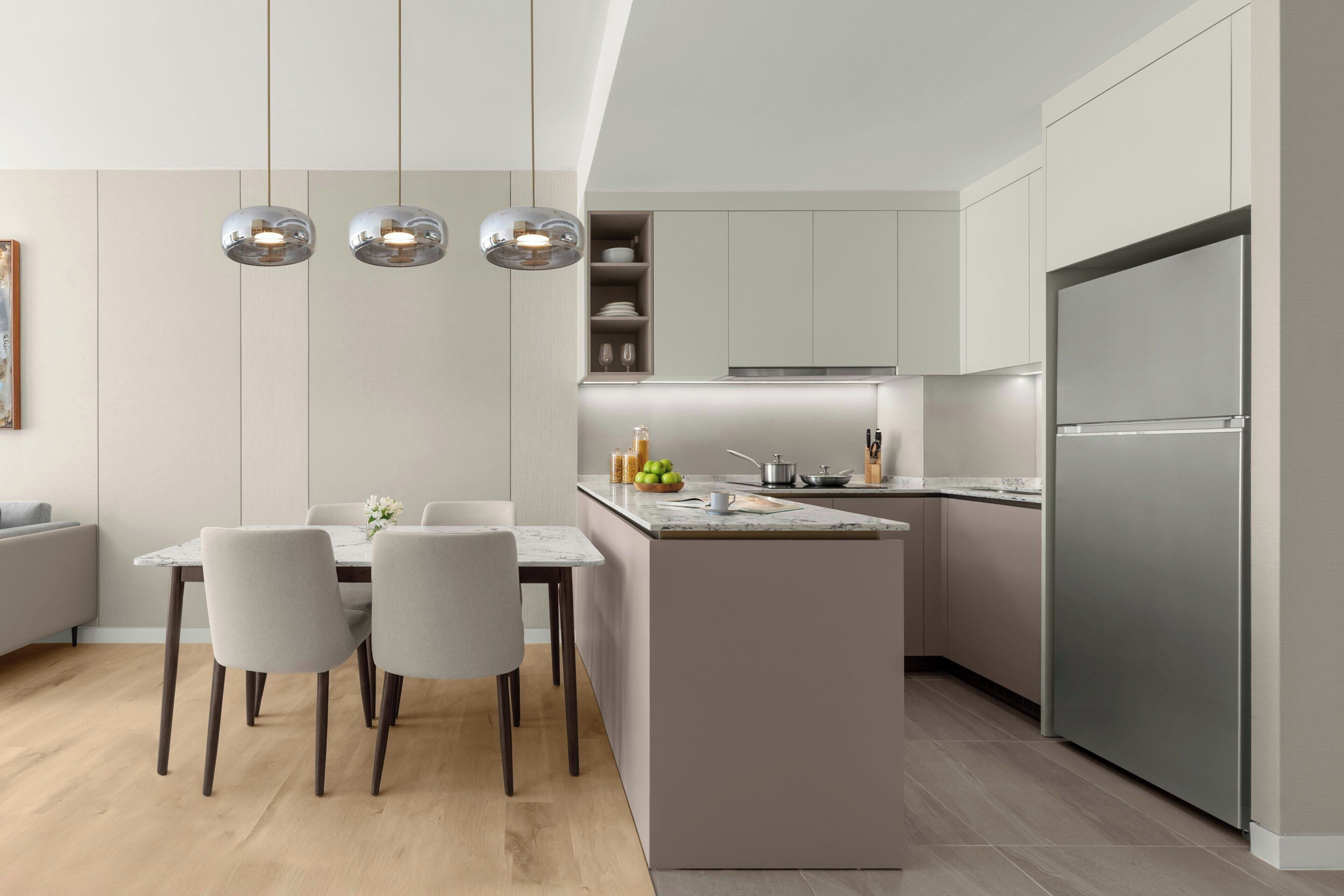 A modern kitchen with a central island, pendant lighting, and built-in cabinetry.