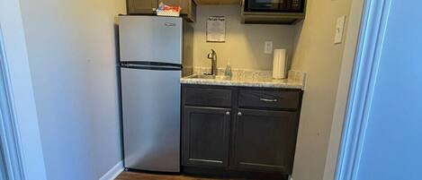 Fridge, microwave, coffee/tea maker, dining tables