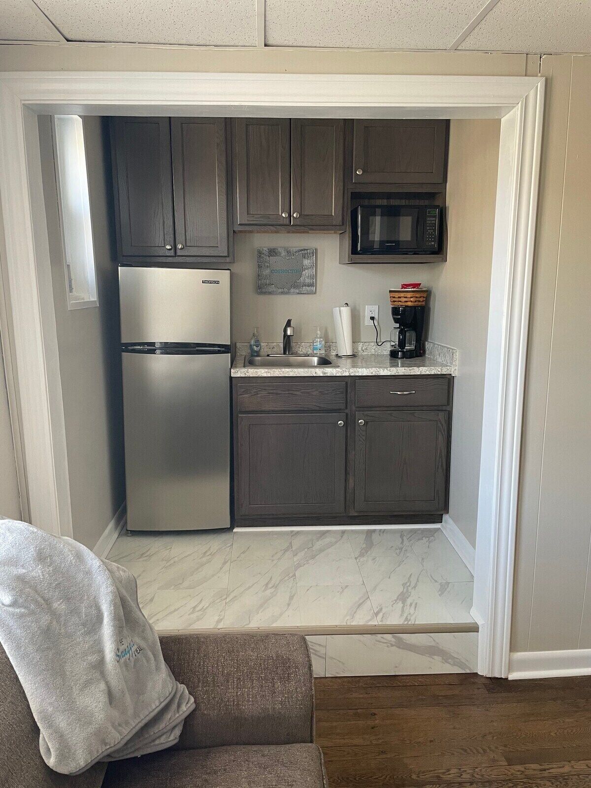 Fridge, microwave, stovetop, coffee/tea maker