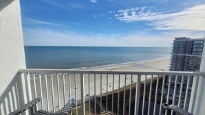A balcony with a view of the beach and ocean. - Newly Renovated 1 Bedroom Beach Condo at SeaWatch Resort Myrtle Beach (Myrtle Beach)