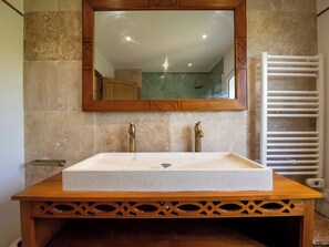 A bathroom with a rectangular sink, two faucets, a wooden vanity, a mirror, and a towel rack. - 400m² Villa with Padel, Pool & Volleyball (Valbonne)