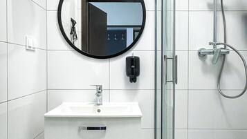 Shower, hair dryer, towels, toilet paper