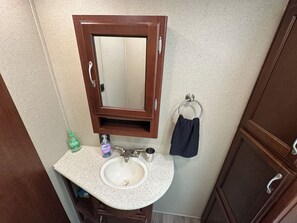 Shower, towels, soap, toilet paper