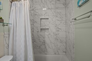 Shower, hair dryer, towels, soap