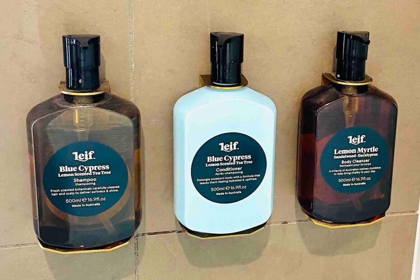 Three bottles of Leif products: Blue Cypress Shampoo, Blue Cypress Conditioner, and Lemon Myrtle Body Cleanser, all made in Australia.