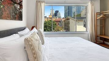 1 bedroom, desk, iron/ironing board, travel crib