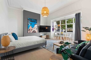 1 bedroom, desk, iron/ironing board, travel crib