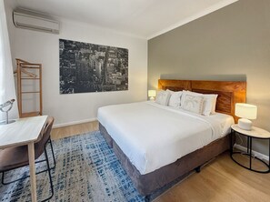 1 bedroom, desk, iron/ironing board, travel crib