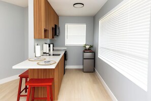 Fridge, microwave, stovetop, cookware/dishes/utensils