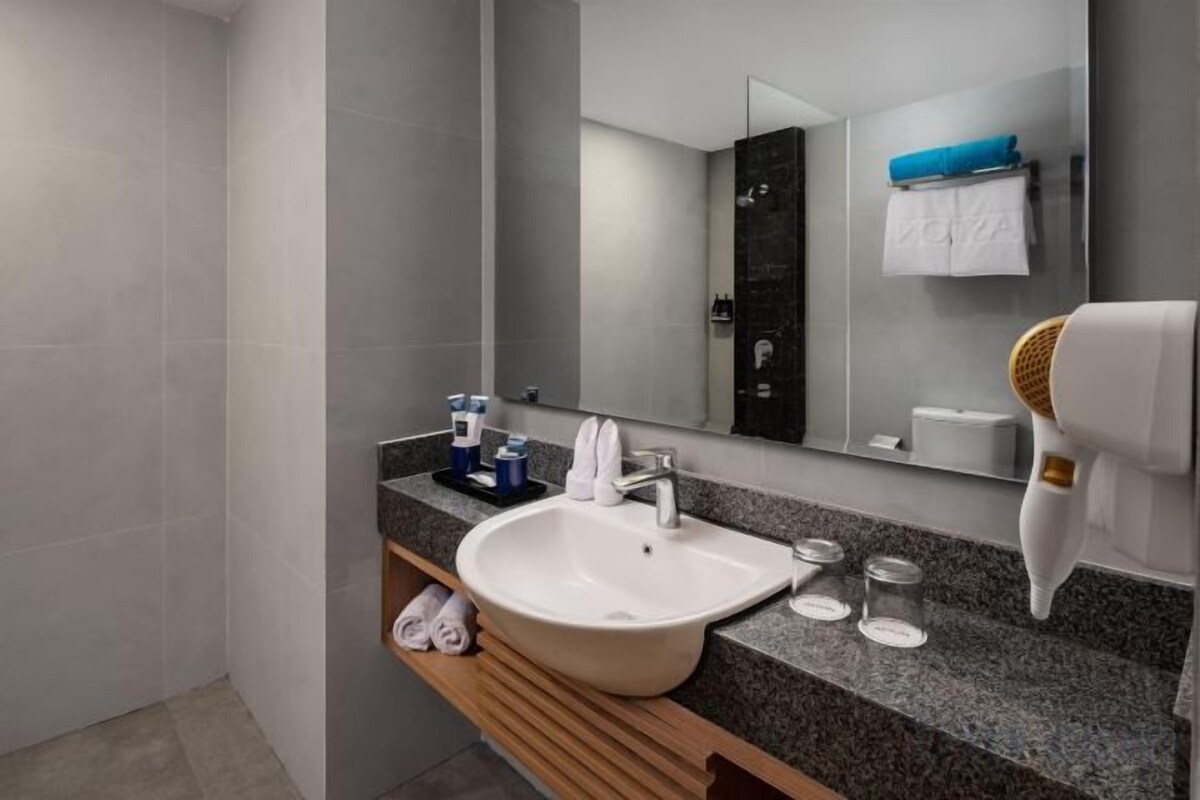 Shower, hair dryer, slippers, towels
