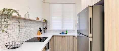 Fridge, microwave, stovetop, coffee/tea maker