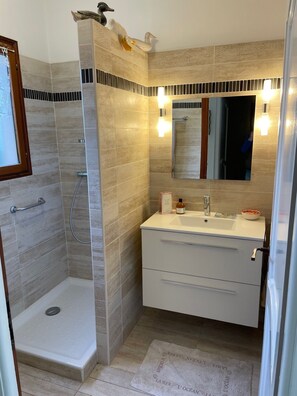 Shower, hair dryer, towels, toilet paper