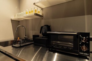 Fridge, microwave, cookware/dishes/utensils