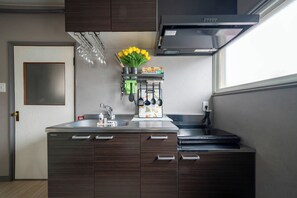 Fridge, microwave, stovetop, cookware/dishes/utensils