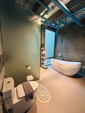 Shower, hair dryer, towels, soap - Cozy loft-style rooms, private baths, free Wi-Fi, A/C, and shared spaces. (Siri Mangkalajarn Rd Lane 7)