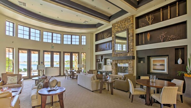 A spacious lobby with a large seating area, a fireplace, and a view of the outdoors. - Gazebo + Putting Green: Serene Indio Getaway (Indio)