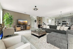 TV, fireplace, books, offices