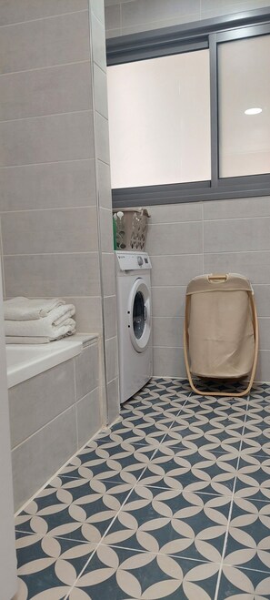 Hair dryer, towels, soap, shampoo