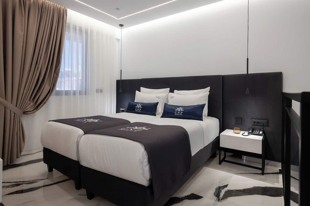 Premium bedding, memory-foam beds, minibar, in-room safe