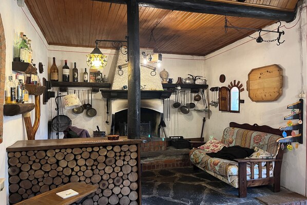 Family Chalet, 4 Bedrooms, Mountainside (Baita Immersa Nel Verde) | Living area | Fireplace - Baita Immersa Nel Verde (Grandola ed Uniti)