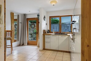 Fridge, stovetop, dishwasher, coffee/tea maker