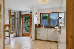 Fridge, stovetop, dishwasher, coffee/tea maker