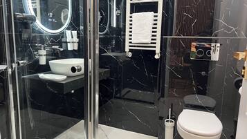 Shower, hair dryer, towels, soap