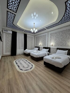 Comfort Quadruple Room | In-room safe, desk, laptop workspace, blackout drapes