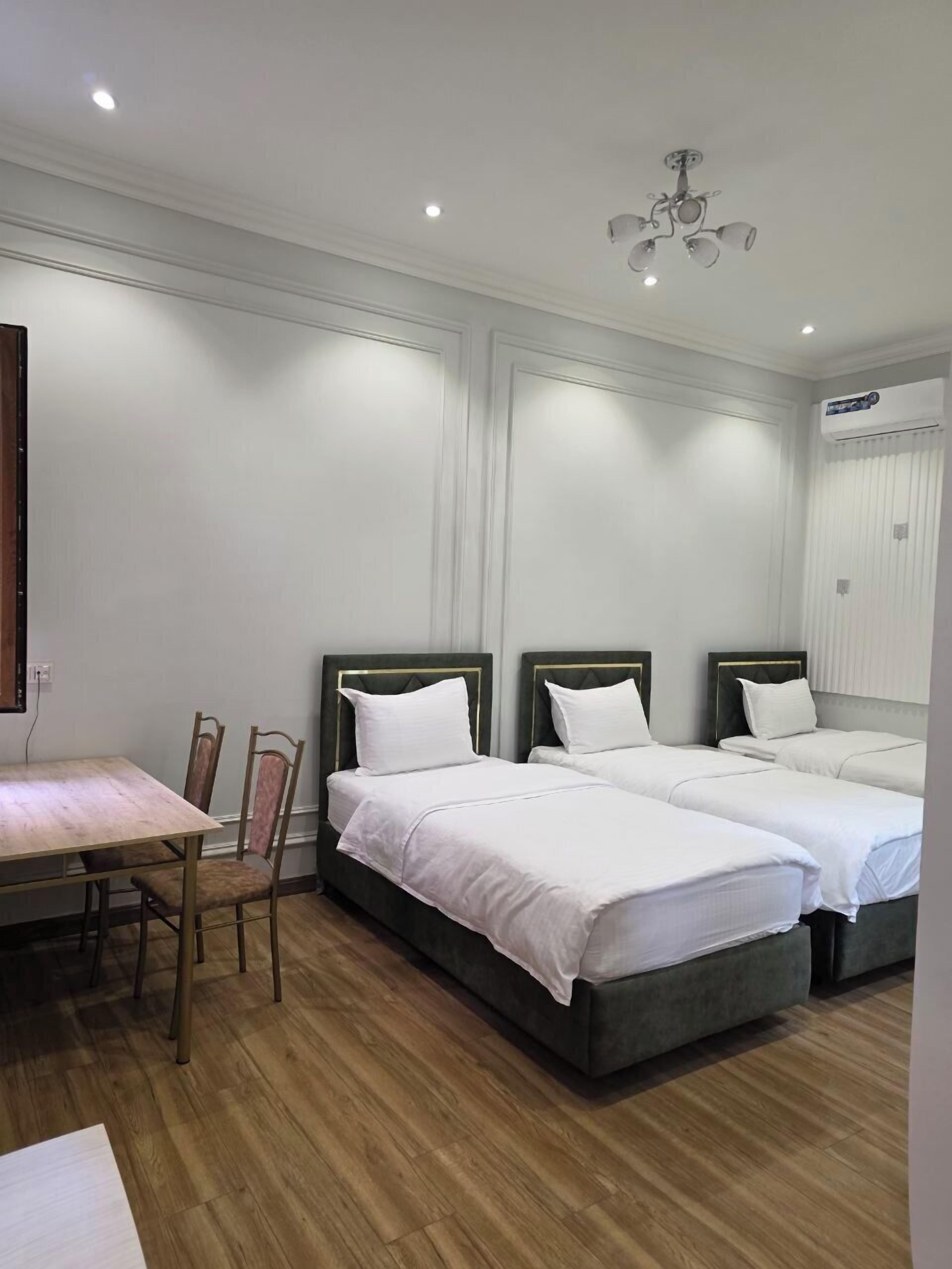 Economy Triple Room | In-room safe, desk, laptop workspace, blackout drapes