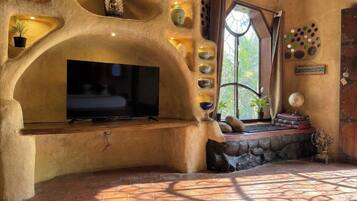 Family Villa, Patio, Resort View | Living area | 43-inch LED TV with cable channels