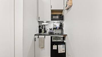 Fridge, microwave, stovetop, coffee/tea maker