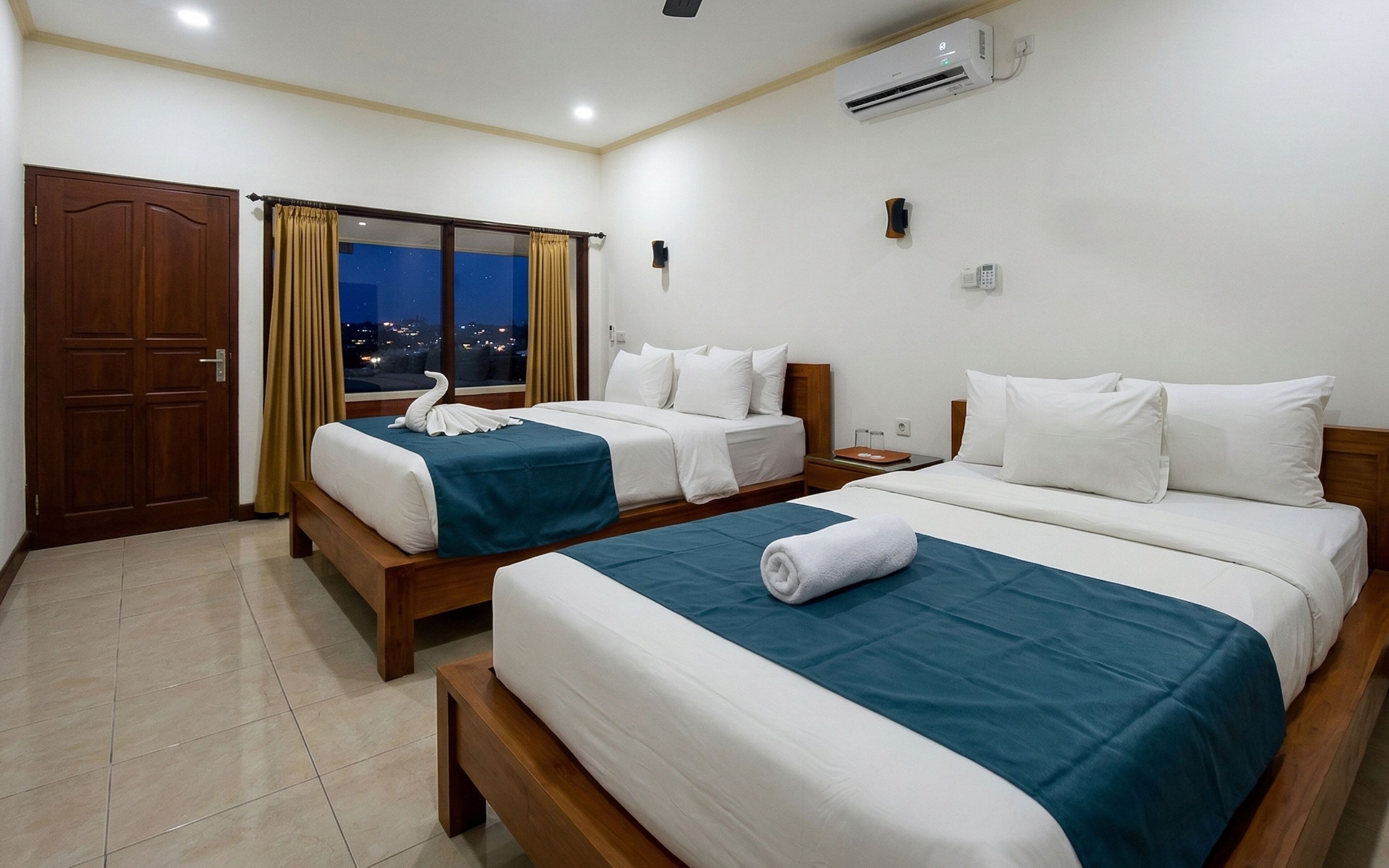 Deluxe driepersoonskamer, balkon | Gratis wifi