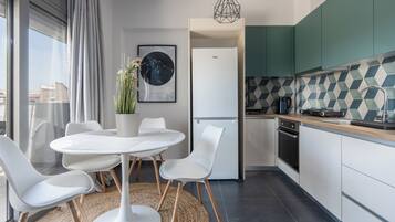 Penthouse Deluxe, vista a la ciudad | Comedor