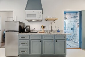 Fridge, microwave, stovetop, coffee/tea maker