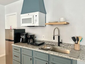 Fridge, microwave, stovetop, coffee/tea maker
