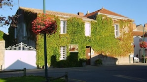 A building with ivy-covered walls and a traditional design.