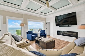 Smart TV, fireplace, DVD player, books - Experience oceanfront bliss at Magic Hour, Oak Island's spacious 7-bedroom retreat for 16. (Oak Island)